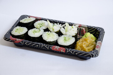 Kappa Maki (Cucumber Sushi Roll) arranged on a tray against a white background.