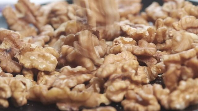 walnut on a plate on table , close up.