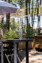 bottle of hydroalcolic gel placed at the entrance of a restaurant
