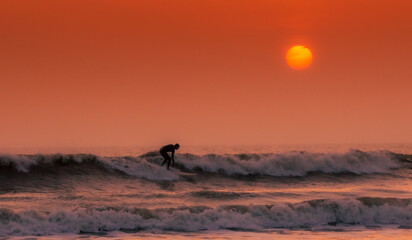 Surfer at dusk