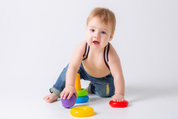 toddler baby boy with toy on white background