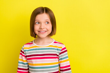 Fototapeta premium Photo portrait little girl in striped clothes smiling looking copyspace isolated bright yellow color background