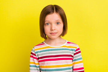 Fototapeta premium Photo of charming pretty young little girl wear striped shirt casual clothes isolated on yellow color background