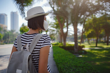 young stylish hipster Asia woman walking on the street