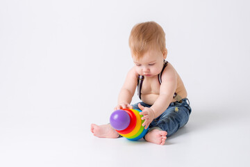 toddler baby boy with toy on white background