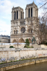 Fototapeta na wymiar View on Notre-Dame de Paris cathedral from Seine embankment