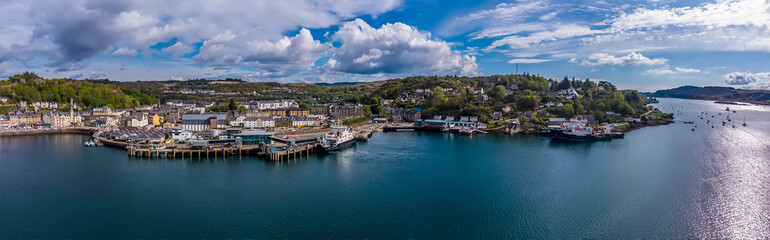 Fototapeta na wymiar A panorama aerial view across the port in the town of Oban, Scotland on a summers day