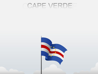Cape Verde flag flutters on a pole standing tall under a white sky
