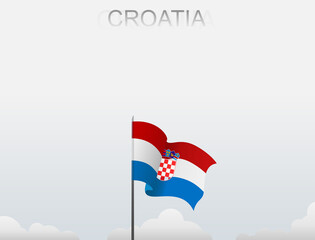 Croatia flag flutters on a pole standing tall under a white sky