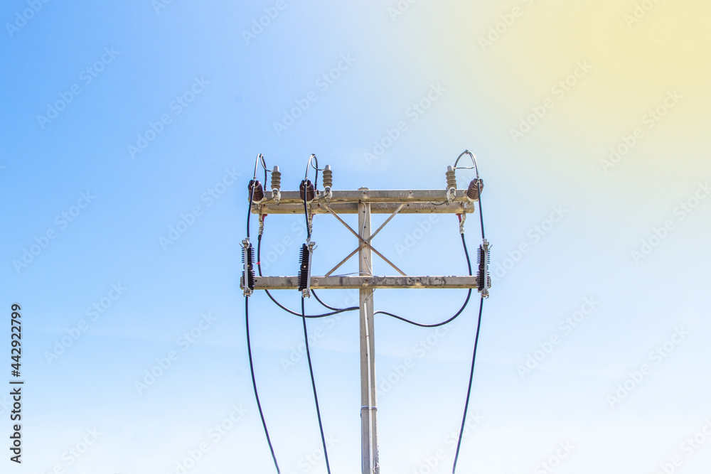 Wall mural close-up of concrete pole electric with power cable on pole for industrial use. blue sky bright on b