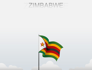 Zimbabwe flag flutters on a pole standing tall under a white sky