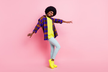 Full length body size view of attractive cheerful girl dancing moving clubbing isolated over pink pastel color background