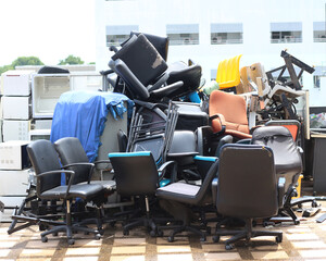 Old office chair lay the pile