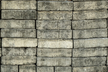 Pile of gray brick blocks for garden decoration or walkway flooring