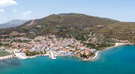 Aerial, drone view of Ancient Epidaurus town beach and port at Peloponnese, Greece.