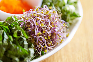 bowl of salad on a wooden table