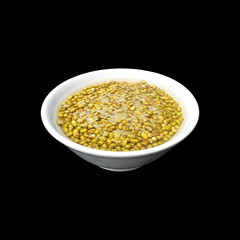 mung beans in a bowl of water isolated on black background