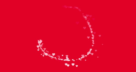 Trail of small pink hearts flying around on red background