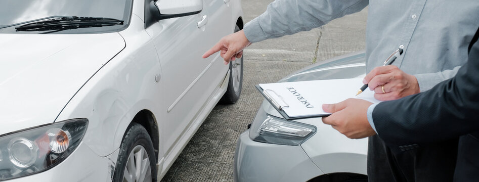 Loss Adjuster Insurance Agent Inspecting Damaged Car. .Sales manager giving advice application form document considering mortgage loan offer for car  insurance