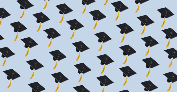 Composition of multiple graduation hats on blue background