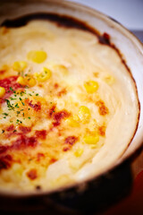 Cheese and seafood gratin on a plate 