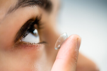 Inserting Contact Lens In Eye