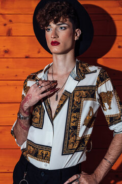 Sensual gay in stylish apparel with makeup