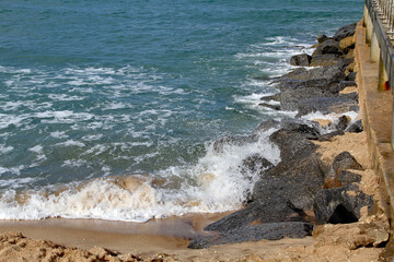 Fototapeta na wymiar Sea, waves, sand and rocks