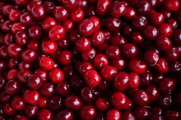 Ripe red cherries, top view, for background