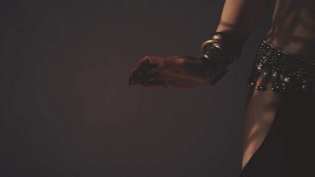 Sensual woman dancing in light and shadow
