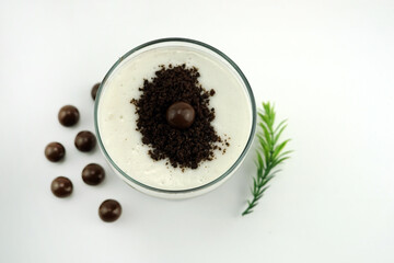 Chocolate pudding with creamy milk and chocolate balls