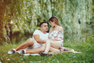 Fototapeta premium Beautiful couple spend time on a summer field