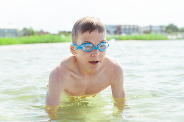 Happy teen boy diving in Baltic sea while summer holidays © spass