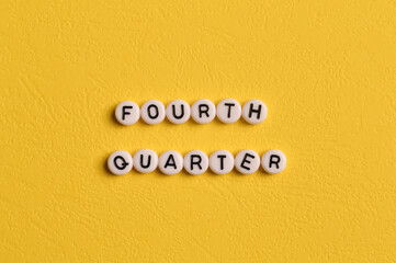 Alphabet letters with text FOURTH QUARTER isolated on yellow background
