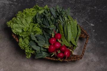 Combine vegetables, kale, reddish, beans in a wicker basket.Copy space