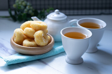 White ceramic tea set with donuts