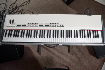 The keyboard of the synthesizer stands on the stage