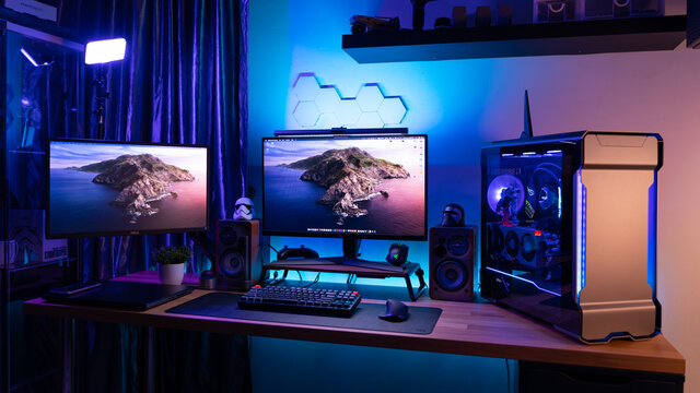 KL, MALAYSIA - June 26th, 2021 :                     A Work From Home Office Setup. HTPC, Hackintosh PC  Gaming PC rig with liquid cooling setup and full RGB light inside 