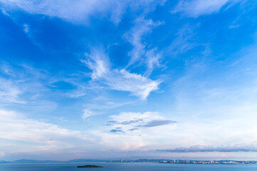 Tropical blue sea and Pattaya City background view from larn island in sunny blue sky day, Chonburi, Thailand
