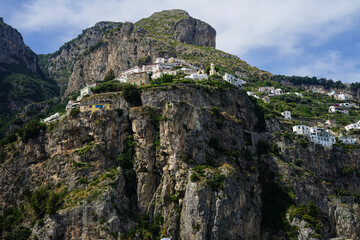 Fototapeta na wymiar Houses on the top of Amalfi coast mountains, Salerno, Campania, Positano, Italy