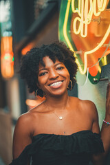 black cute woman smiling to the camera