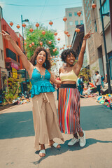 Naklejka premium two black girls having fun in the street