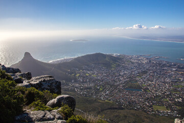 View of Cape Town (Western Cape, South Africa) from the top of Table Mountain during a sunny morning. The lookout point is close to the visitor center.