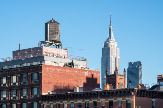 Empire State Building and traditional New York City brick building architecture in Midtown Manhattan