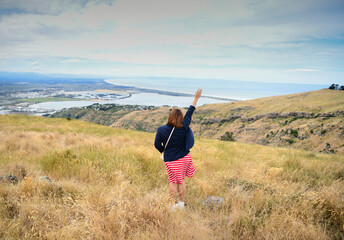 Fototapeta premium woman at the top of mountain view