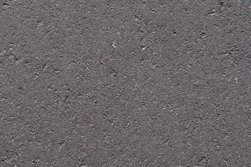 Close up of black asphalt road texture. Dark asphalt background for your project