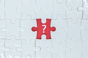 Missing a pieces of puzzle in the center, red space with question mark icon.