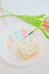 White cake with painted on white background,DIY cake,.dessert