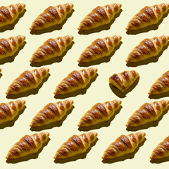Bakery products pattern with baked croissant at minimal background. Top view, flat lay, concept of modern minimal picture