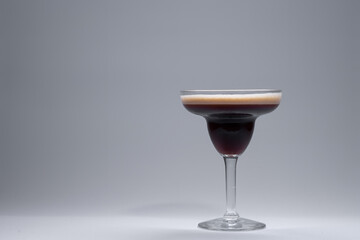 luxury espresso martini cocktail drink in elegant glass on white background